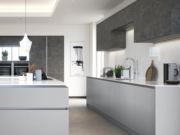 Modern kitchen with white cabinetry and grey stone effect upper units, featuring a central island with white countertop, pendant light fixture, stainless steel sink with chrome tap, built-in ovens, white walls, recessed ceiling lights, wooden chopping board, potted plants, and kitchen accessories on the counters