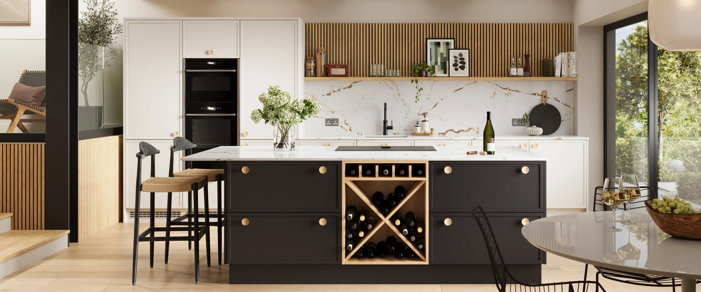 Modern open-plan kitchen and dining area with white upper cabinetry, black lower island featuring wine storage with X-shaped wooden racks, marble splashback, built-in black appliances, wooden fluted detailing on back wall, bar seating with woven chairs, and access to garden through glass doors on the right.