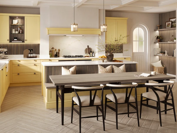 Modern kitchen and dining space with yellow cabinetry, marble backsplash, and white coffered ceiling featuring a central island with seating, pendant lighting, and a wooden dining table with black chairs positioned in the foreground.