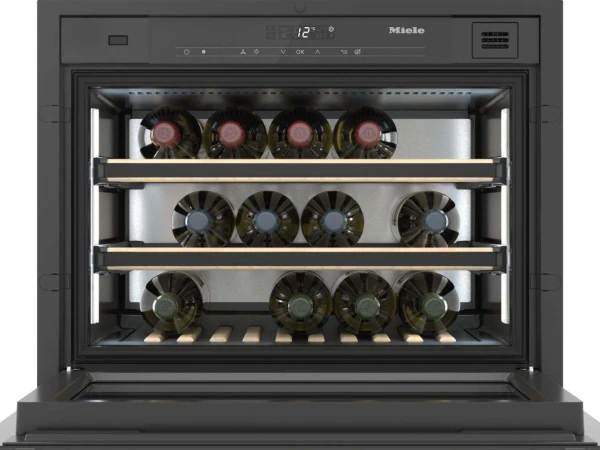 Miele wine cooler with glass door displaying three shelves of wine bottles, digital temperature display showing 12 degrees, illuminated interior, and control panel at the top.