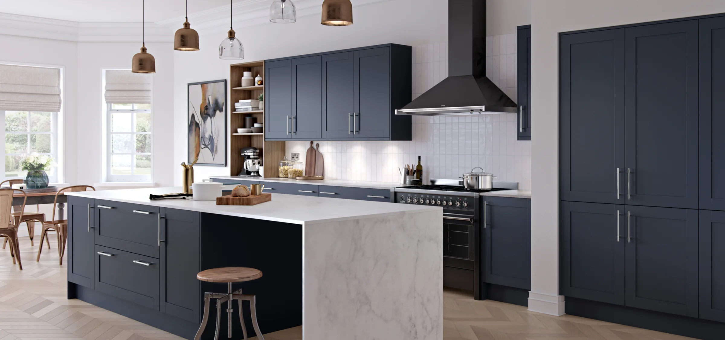 Modern kitchen with dark cabinetry, marble island, white subway tile backsplash, and brass pendant lights.