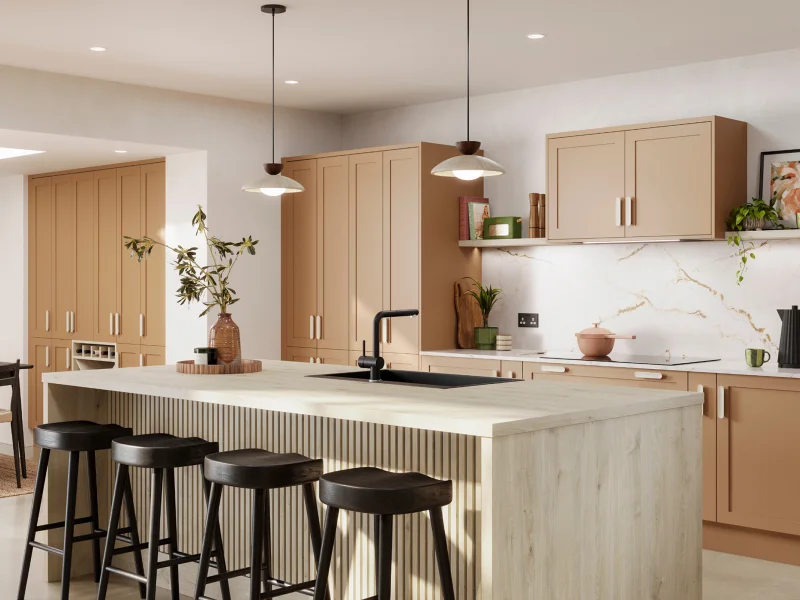 Modern kitchen showroom with light wood cabinetry, white marble backsplash, and black bar stools at island.
