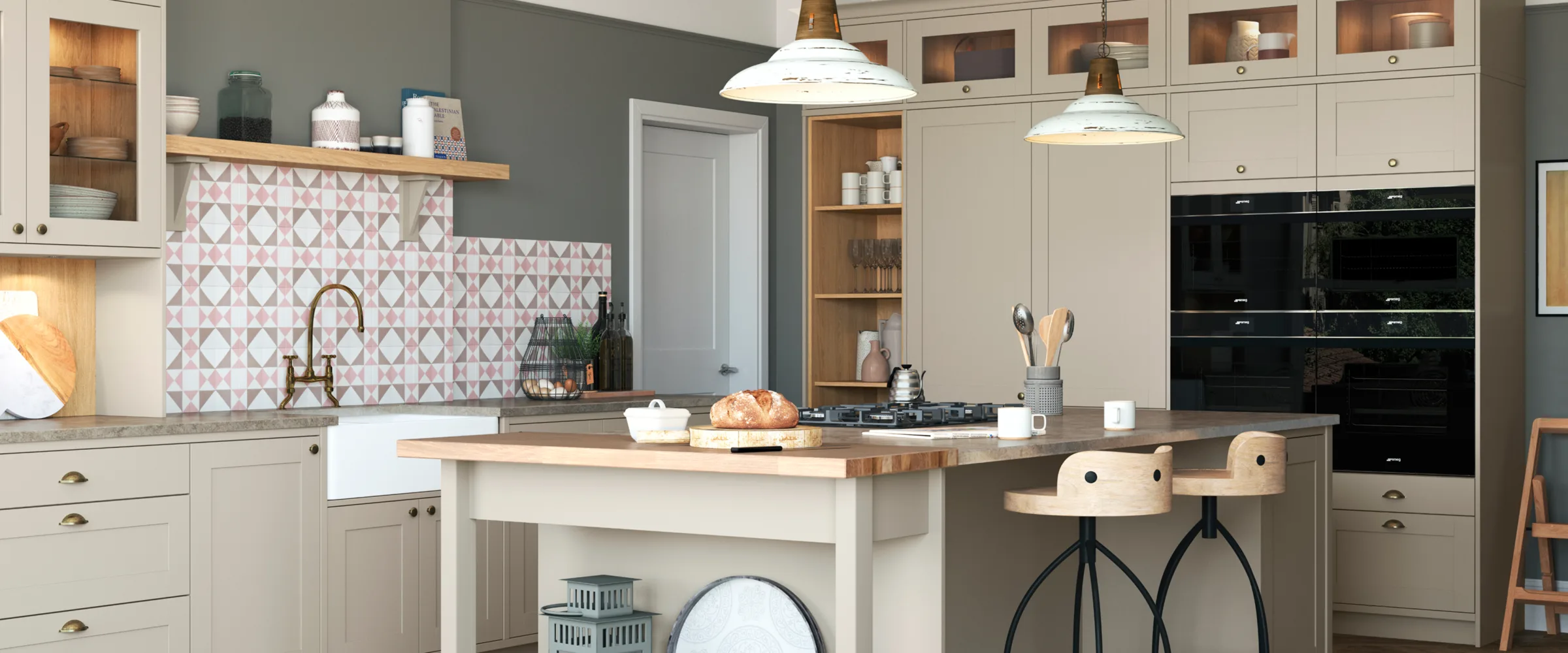 Modern kitchen showroom with cream cabinetry, patterned splashback, island seating, and black integrated appliances.