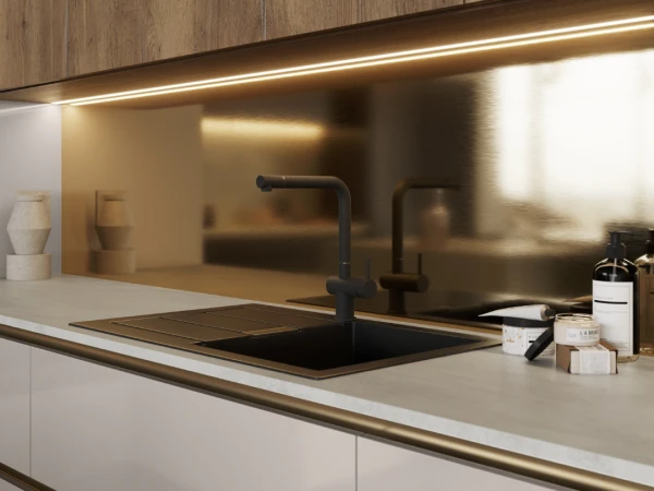 Modern kitchen with white lower cabinets, wood-grain upper cabinets, integrated LED lighting under the upper cabinet, black matte sink with tap, beige backsplash, and light countertop with minimal styling.