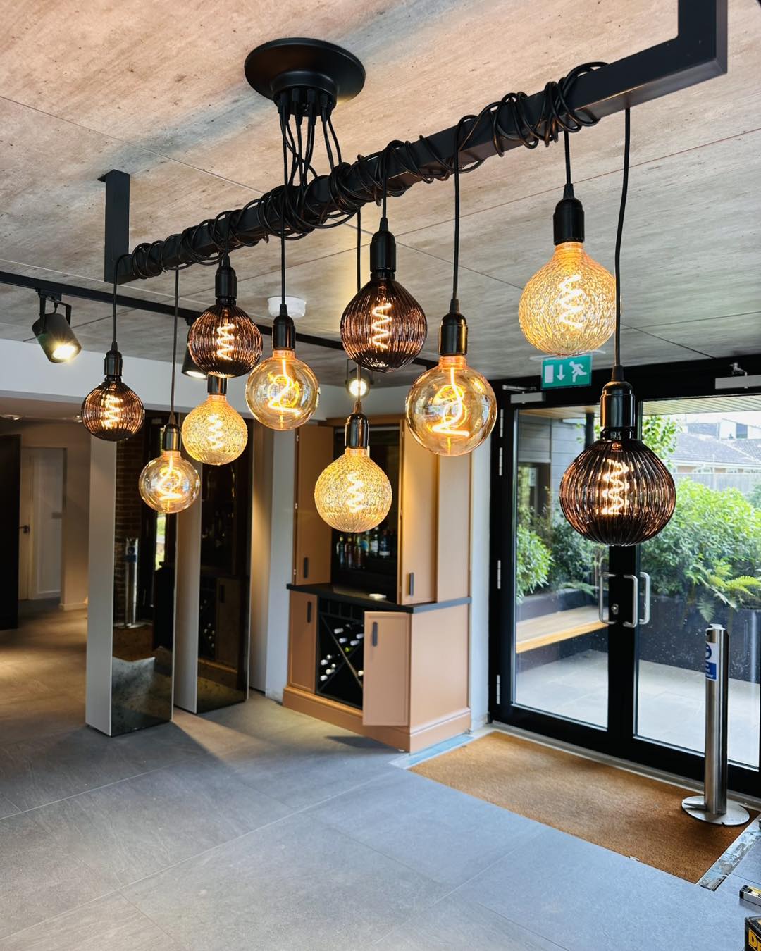 Statement cluster of pendant lights in the Veluto showroom