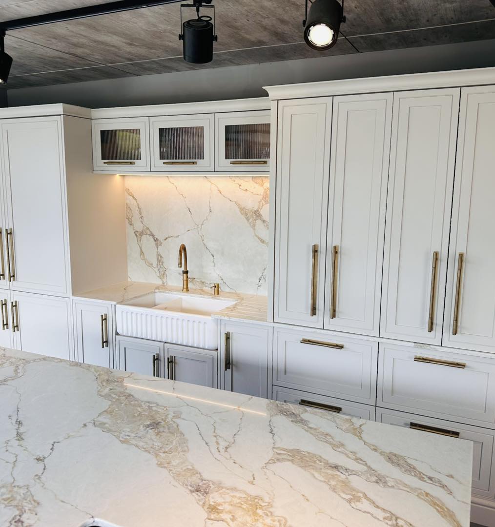 Classic in-frame kitchen with marble splashback and brass handles